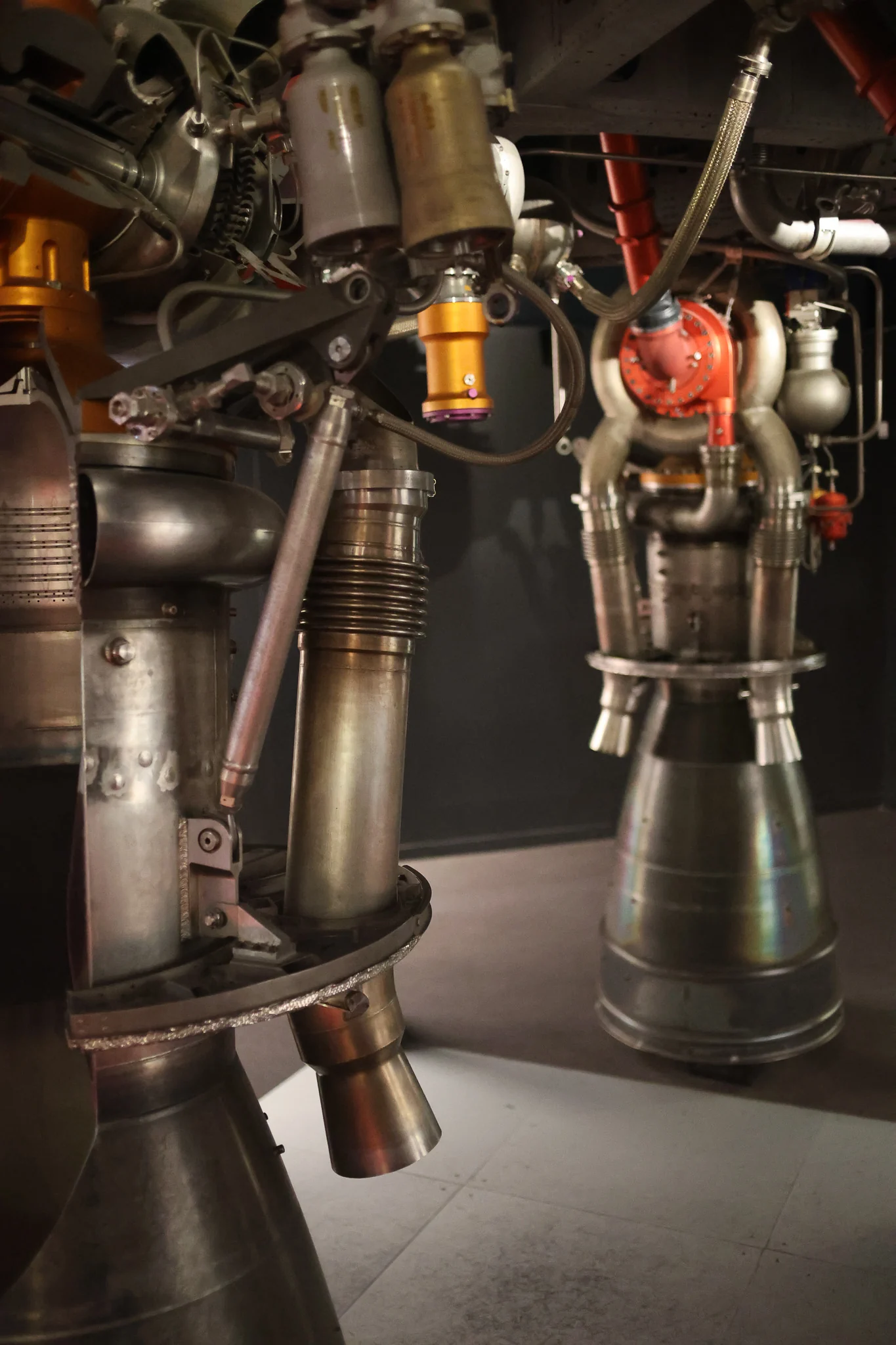 Close-up of the Ariane 1 Viking rocket engine assembly showing metal nozzles, pipes and mechanical components