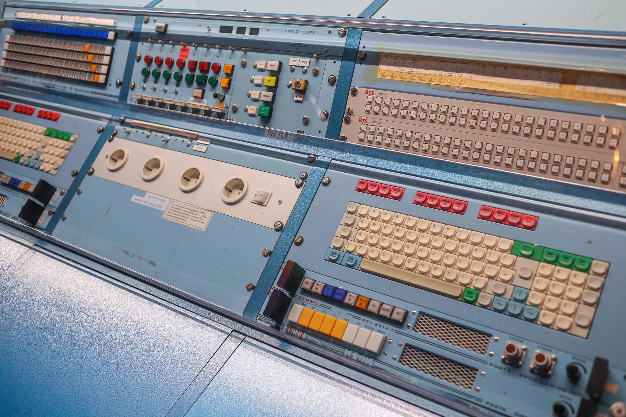 Original Ariane 4 launch control console with rows of switches, indicator lights and control panels
