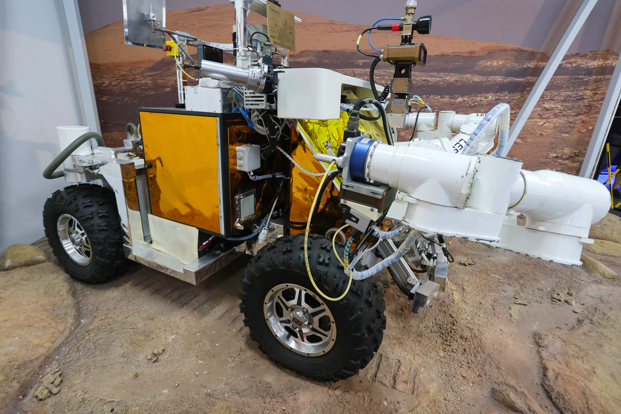 ESA Eurobot Ground Prototype with four wheels and robotic arms displayed at Space Expo Noordwijk